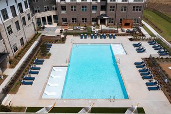 Resort-style pool with tanning ledges